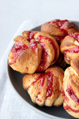 Yeast buns with raspberry jam