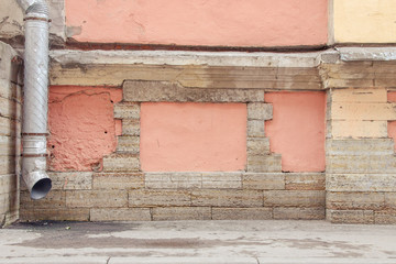 fragment of an old wall painted with pink paint