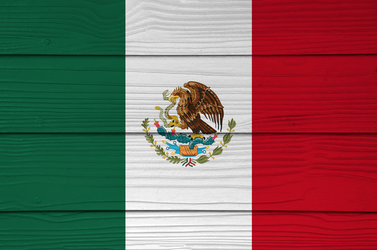 Mexico flag color painted on Fiber cement sheet wall background, a vertical tricolor of green white and red with the nation Coat of Arms centered.