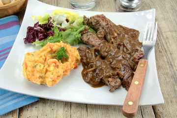 beef steak with shallot sauce and mashed potatoes and carrot