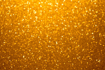 Festive golden bokeh background with sparkling glitter