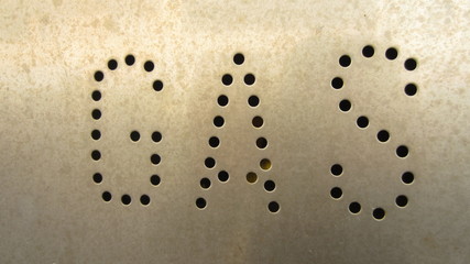  inscription "gas" engraved in metal by holes 
