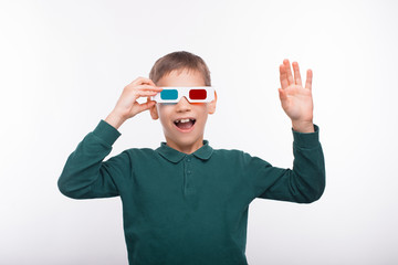 Portrait of amazed young boy wearing 3d glasses