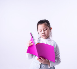 The little girl reading book with interested feeling,smart children