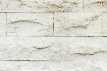 the wall is faced with stone tiles