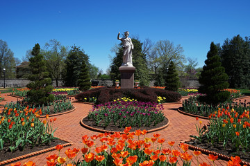 Green park with arrangement of colorful flowers and structure buildings at Saint Louis town -Missouri ,United States