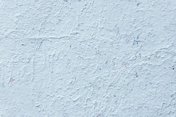 the wall is splattered with paint of different colors