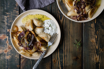 Dumplings, pierogi, pelmeni, ravioli with fried onions