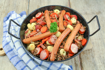 sausage and lentils dish on a wooden table