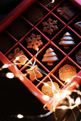 Beautiful Christmas box with natural chocolates in the form of snowflakes, Christmas trees, stars