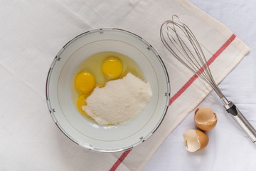 Lemon curd in a glass jar on a white background, ingredients for cooking, lemon kyrd recipe