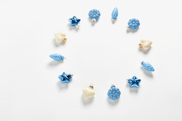 Christmas decor in the form of cone, heart and stars in blue color on a white background. new year's concept frame. flat lay, top view