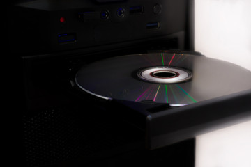 Color spectrum on a CD  sitting in the computer cd- rom drive.