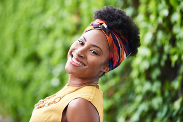 Attractive young african american woman listening to music at a