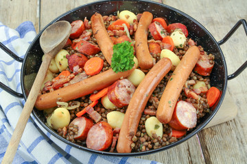sausage and lentils dish on a wooden table