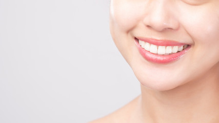 Close up of  white healthy teeth of beautiful smile young woman