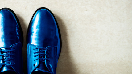 Trendy Leather Lace Up Brogues of Blue Color, autumn shoes, grey background. Top View, Copy space, flat lay