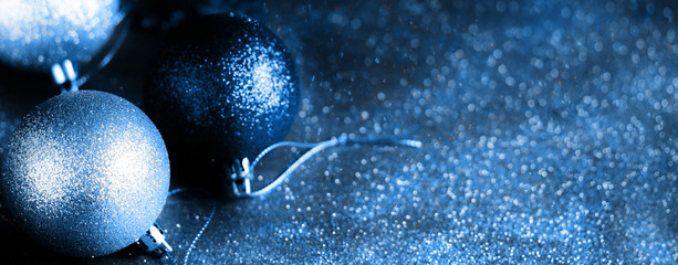 Christmas blue background with bokeh, lights and Christmas balls. defocus. blurred focus. copy space