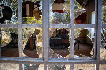 looking through broken glass inside old vintage factory
