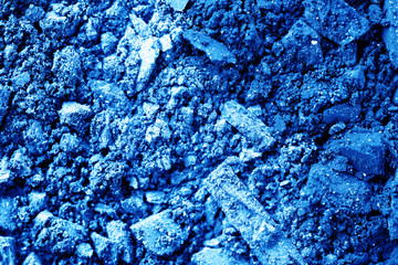 Multicolored crushed eyeshadows with brush isolated on white background.