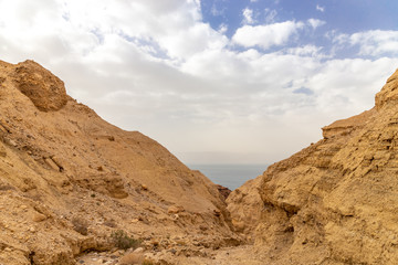 Fototapeta na wymiar Hiking trail at the Wadi Mujib reserve. View of the Dead sea. Jordan