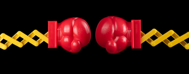 Two toy boxing gloves isolated on black