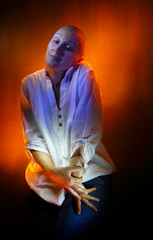 Artistic portrait of a lady in a white shirt created by colored light
