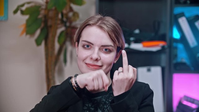 A business woman showing a middle finger - fuck you concept