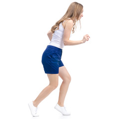 Woman in blue shorts and white shirt smiling goes walking on white background isolation
