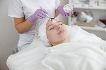 young girl in beauty salon, laser epilation and beauty