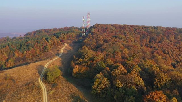 Communication tower on the hill top in fall season