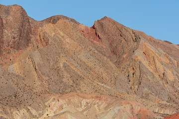 Fototapeta premium Landscape of barren multi-colored stone hill in Lake Mead National Recreation Area in Nevada