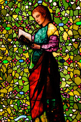stain glass picture of a saint reading book st Patrick cathedral    