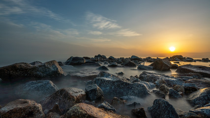 Tranquil Sea Stone At Sunset