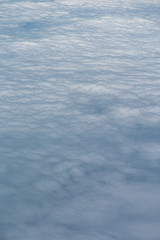 Full view of clouds from above - white gray cirrocumulus clouds - no land or sky visible