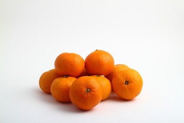 fresh tangerine mandarin fruits on white background