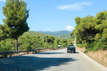 Car on a scenic greek rural road in the mountains of Peloponnese, Greece