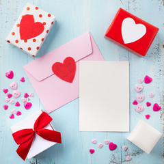 Pink envelope with empty paper and red heart