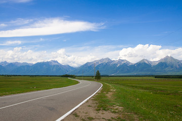 Naklejka premium road and blue sky in the mountains