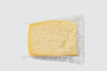 ellow cheese in plastic packaging