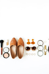 Flat lay fashion collage with women modern accessories, cosmetics on white background. Shoes, sunglasses, bracelet, earrings, lipstick, powder. Lifestyle concept for blog, social media, magazine.