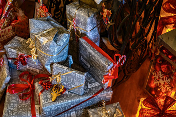 Many packed Christmas presents with decoration.