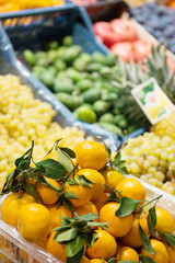 Fresh tangerines on a counter close-up.