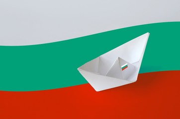 Bulgaria flag depicted on paper origami ship closeup. Handmade arts concept