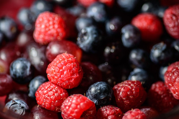 Close-up - group of blackberry, grape and raspberry selective focus