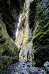 volcanic cave of Gljufrafoss with a little creek in Iceland