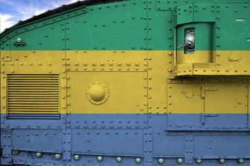 Gabon flag depicted on side part of military armored tank closeup. Army forces conceptual background