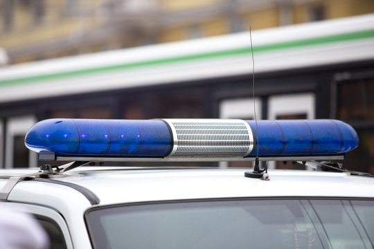 luminous blue flashing light with a police car siren