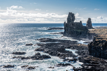 Londrangar basalt rock monolith at the southcoast of Snaefellsness peninsula in western Iceland, landscape photography