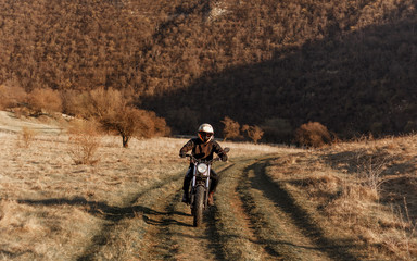 Motorcyclist Driving Along A Winding Road. Extreme sport.